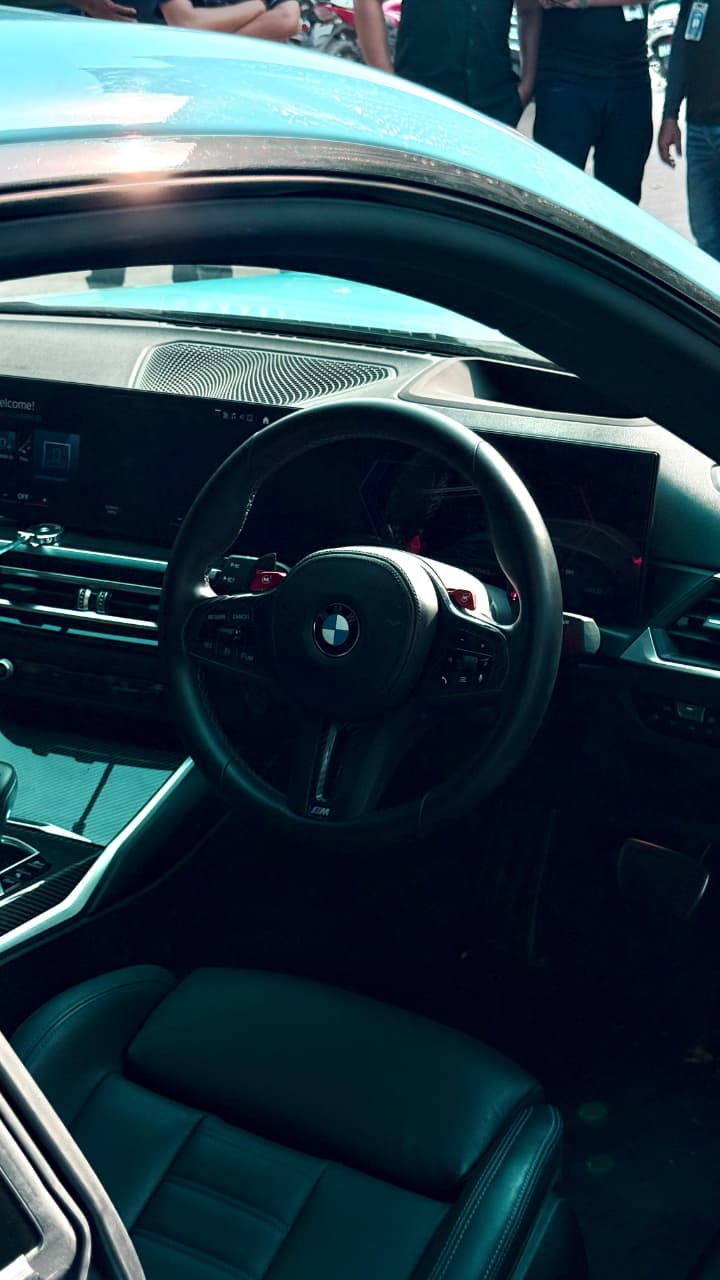 Car engaging in high-speed drift racing maneuvers